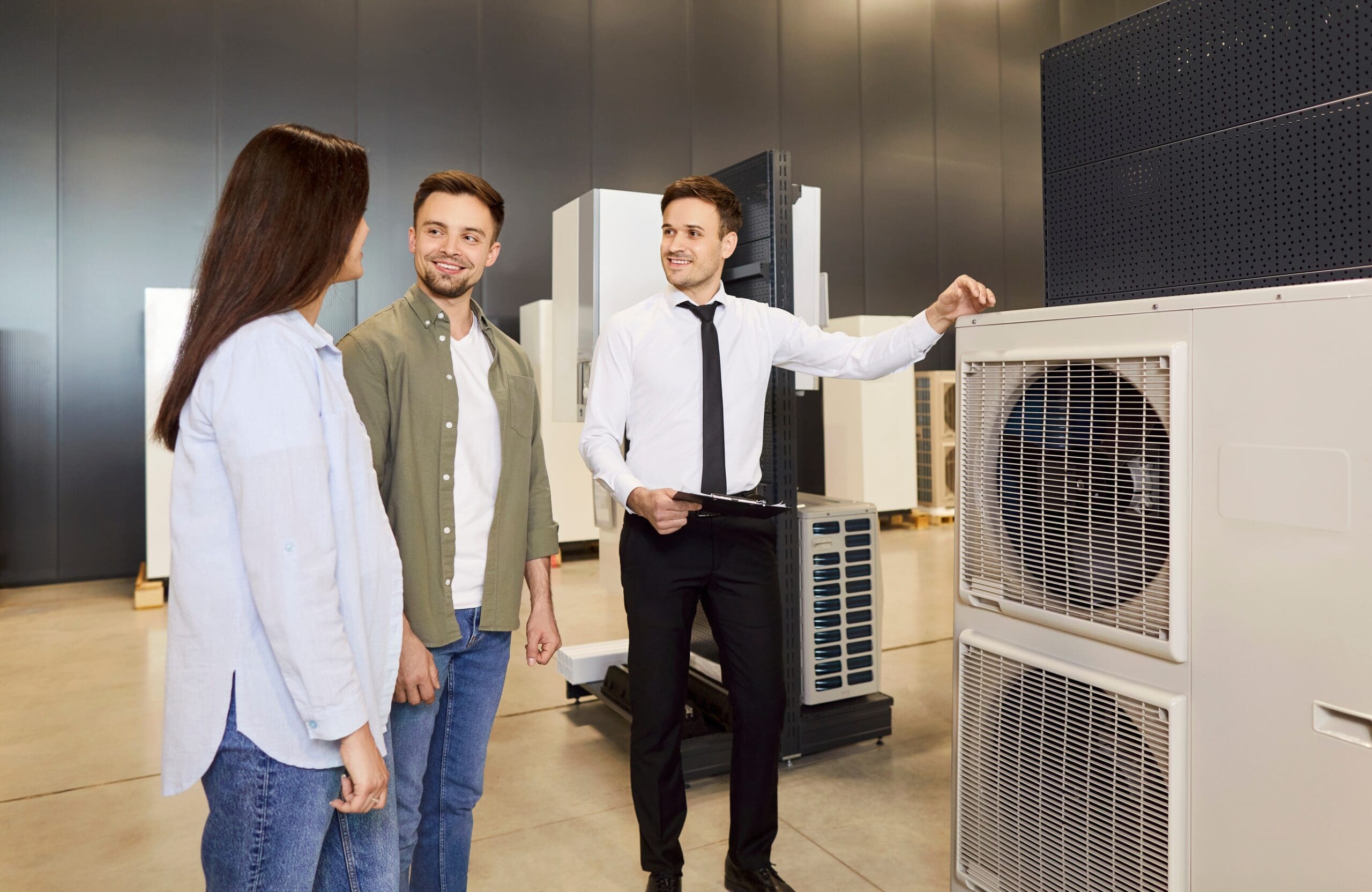 Salesman talking to homeowners about a new HVAC system